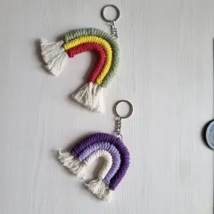 Two more rainbow keychain designs, one in a classic rainbow palette and another in shades of purple.