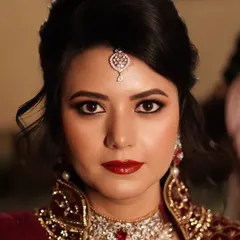 A classic, bold look never goes out of style. Here, I paired a sophisticated, shimmering eye with a timeless red lip to create an unforgettable statement for her celebration. This is for the client who loves to embrace glamour with confidence and poise.