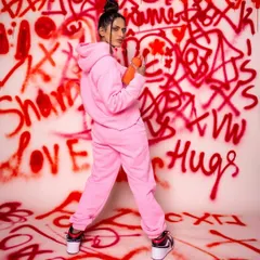 To show my creative range, I designed this urban-style shoot with a custom graffiti background. The vibrant pinks and the model's confident pose create a high-energy fashion shot that stands out from typical portfolio work.