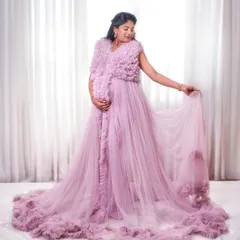 Our ruffled Clara gown in a lovely lavender shade. The full, dramatic trail is made of layers of soft tulle, perfect for a princess-themed shoot.