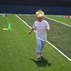 The pure joy of running! A happy child sprints across the field during our Sports Day. We create a supportive atmosphere where every child feels like a winner.