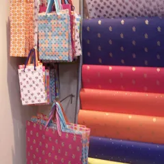 A look back at where it all began in 2003. This was our very first store, filled with colorful gift bags and rolls of handmade paper. Life was simpler then, and so was our shop.