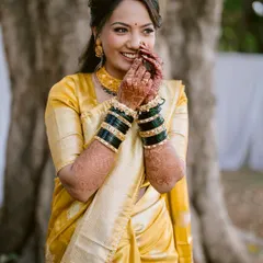 The shy, happy smile of a bride on her wedding day. This candid portrait captures the beautiful emotions of the moment.