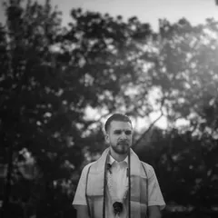 A moment of anticipation. I captured the groom against the morning sun, the backlighting creating a soft glow. This black and white portrait feels timeless and full of emotion.