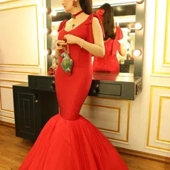 The silhouette of this gown was key. The fitted bodice flows into a dramatic, flared train, creating a classic red carpet shape that photographs beautifully from every angle.