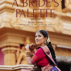 A beautiful portrait of a bride in a traditional blue and pink saree, posing against the backdrop of a temple.