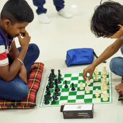 Two young strategists deeply engrossed in their game. We use standard chess clocks even in our youth events to provide a complete and professional tournament experience.