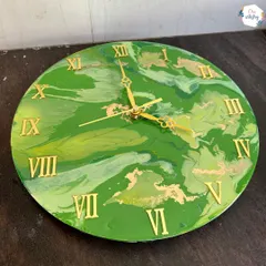 For those who love a pop of color, this green and gold marble effect clock is a vibrant choice. The fluid patterns in the resin mean no two clocks are ever identical.