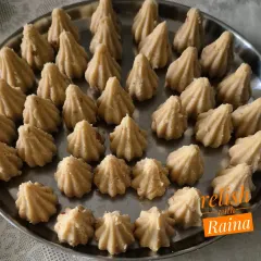 A platter of Rava Modaks made with jaggery. These are made with fine semolina roasted in ghee and flavored with nuts and cardamom.