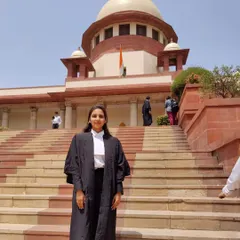 Posing on the steps of the Supreme Court of India. Practicing here requires a deep understanding of law and procedure, which I bring to every case I handle.