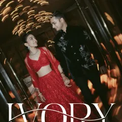 A classic, romantic portrait with a twist. We used a slow shutter speed to create a dreamy light-blur effect, enveloping the couple in a warm, magical glow for their Sangeet night.