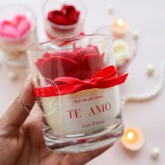 Holding the 'Te Amo' jar candle to show the custom "Love Potion" label. It's a perfect gift for your valentine.
