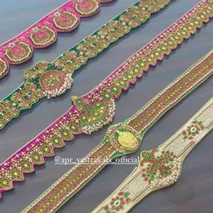A closer look at the craftsmanship, highlighting a belt with a Lakshmi kasu coin, another with peacock motifs, and a classic kemp stone design.