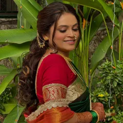 Elegance in simplicity. This Maharashtrian bride's engagement look is all about timeless beauty, with subtle makeup and soft curls that enhance her natural glow.