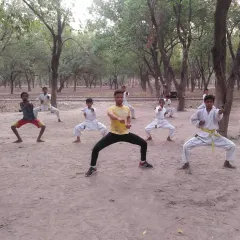 Students practice their horse stance during an outdoor session. The focus and discipline remain the same, whether we are inside the dojo or out in the open.