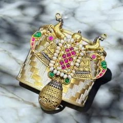 A close-up of a custom dual-tone fusion cuff. This piece combines a woven silver base with a stunning gold-plated centrepiece, featuring Kundan work and colourful stones. It’s tradition with a twist.