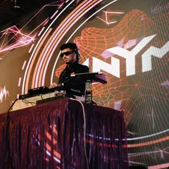 Focused on the mix during a high-energy wedding set in Mathura. The custom visuals with my logo add a professional and personalized touch to the event.