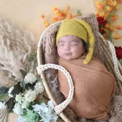 This is the classic, peaceful newborn portrait that every parent cherishes. Using soft, earthy tones and natural textures, I create a serene boho-inspired setting that highlights the pure innocence of your sleeping baby.