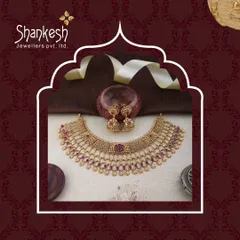 This antique choker set with matching jhumkis is embellished with deep red stones. The design is both traditional and bold, making it a statement piece in any collection.