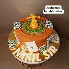 A casino-themed cake complete with a roulette wheel, playing cards, and poker chips.