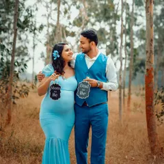 Let's take our session outdoors. I help couples find the perfect natural backdrop in Bangalore for their maternity photos, creating a relaxed and beautiful setting to capture your story, just like this one.