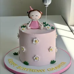 Turning her "ONE-derful" day into the sweetest memory. This first birthday cake captures innocence and joy with soft pastels, tiny daisies, and a hand-crafted fondant baby topper.