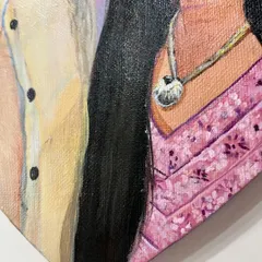 A close-up detail of a commissioned couple's portrait on a heart-shaped canvas. I focused on capturing the texture of the clothing and the warmth of their connection.