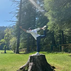 Performing Natarajasana (Dancer's Pose) in the beautiful meadows of Khajjiar. The fresh mountain air and open space make every breath and movement feel more alive.