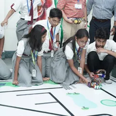 A student from our program focuses intently during the Robotics Championship held at IIT Delhi. We provide platforms for young innovators to test their skills on a national stage.