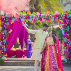 For Prachi and Sandeep's vibrant Mehendi, we used a smoke bomb to create this energetic and colorful shot. It's all about capturing the fun and excitement of your pre-wedding celebrations in a dynamic way.