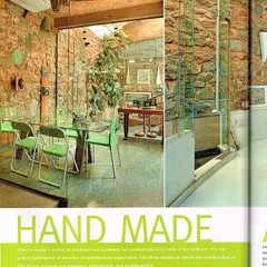 The interior of this home celebrates its "hand-made" origins, where every detail is intentional. I used exposed local quartzite stone for the walls to provide natural texture and thermal mass, contrasting it with modern glass and simple furnishings. This space demonstrates my belief that sustainable design can be both rustic and refined.