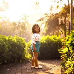 A quiet glance back, with the beautiful morning light creating a soft glow. Even in a playful session, there are these gentle, soulful moments that I make sure to capture.