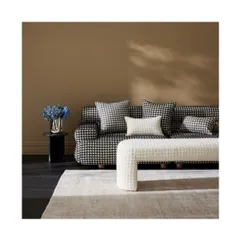 The 'Mario' fabric is a contemporary and on-trend textured woven boucle with a classic houndstooth pattern. Its sophisticated and luxe feel is perfect for creating modern, comfortable seating for both residential and commercial spaces.