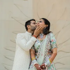 A playful kiss on the cheek that results in a burst of laughter. These are the moments that truly define a relationship, full of fun, affection, and genuine happiness.