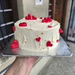 A close-up of the heart-themed cake from the cake and cupcake combo, perfect for Valentine's Day or an anniversary.
