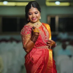 Ready for her reception in a gorgeous red silk saree. I created a full-coverage, glamorous look with matching jewelry that ensures she will be the star of the evening.