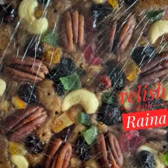 This is a close-up of my traditional Christmas plum cake. You can see how it's loaded with premium nuts like pecans and cashews, and a variety of fruits that I soak for months in rum for that authentic, rich flavour.