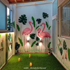 This balcony became a vibrant tropical escape with a hand-painted flamingo mural. It’s a perfect example of how we can bring the outdoors in, creating a fun and inviting space for family gatherings or a quiet evening.