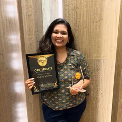 A proud moment holding one of my baking awards. Every recognition fuels my passion and reminds me why I started this journey six years ago.