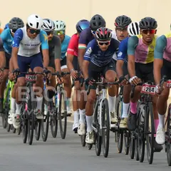 This is what premier road racing looks like. A massive peloton of dedicated cyclists battles for position during the Bangalore Classic Road Race, showcasing the scale and intensity of our events.