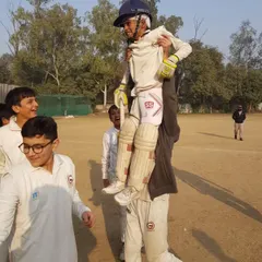 The pure joy of celebration. A player is carried on the shoulders of his teammate after a great performance.