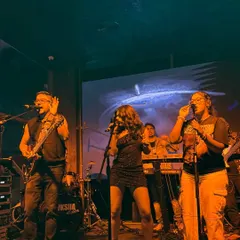 Here I am with the Moksha All Stars, my full-power party band. We love getting on stage together and bringing that big sound for weddings and corporate events, playing everything from rock to pop.