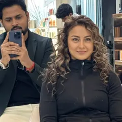 A selfie with my happy client, showing off her new dimensional color on her beautiful curls.