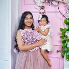 A close-up of a smiling mother and her adorable baby. These are the moments you'll cherish forever.