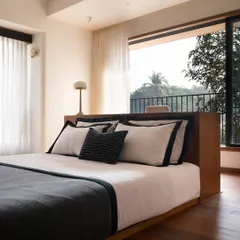 In this bedroom, the study table seamlessly transitions into the platform bed. This integrated design is a solution I use to create an uncluttered perimeter and maximize floor space in smaller rooms.
