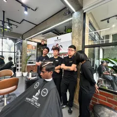 Teamwork is everything. Here, my stylists are observing a haircut, a great example of how we learn from each other to constantly improve our skills.