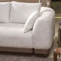 The Verona Curve Sofa, inspired by Italian mid-century modern aesthetics. Wrapped in a textured bouclé fabric, it features a floating walnut arm ledge that serves as both a design accent and a functional surface.