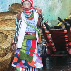 A moment of stillness amidst the chaos of the city. This shot from the "Kaleidoscope" series juxtaposes high-fashion knitwear with a raw, industrial background, creating a story of finding beauty in unexpected places.