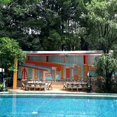 For a vibrant Rajasthani Mehendi, we splashed color in an unconventional way. We avoided the typical pinks and reds, instead creating a unique palette for the food area backdrop that was both traditional and fresh.