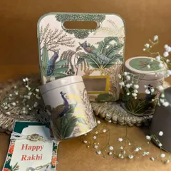 This Rakhi hamper, with its peacock-themed tin boxes and a beautiful Rakhi card, is inspired by the timeless bond of love and devotion. It’s a thoughtful way to honor your sibling.